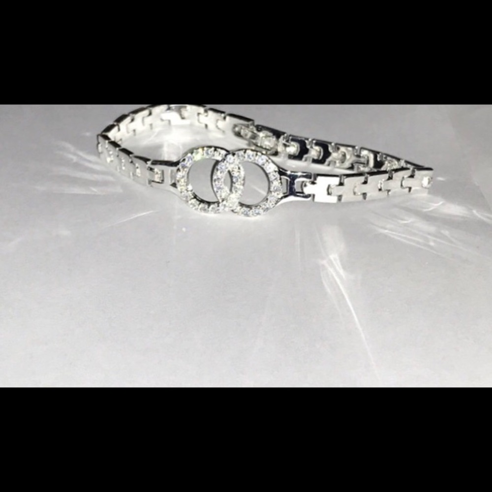 Silver plated zircon figure eight bracelet.