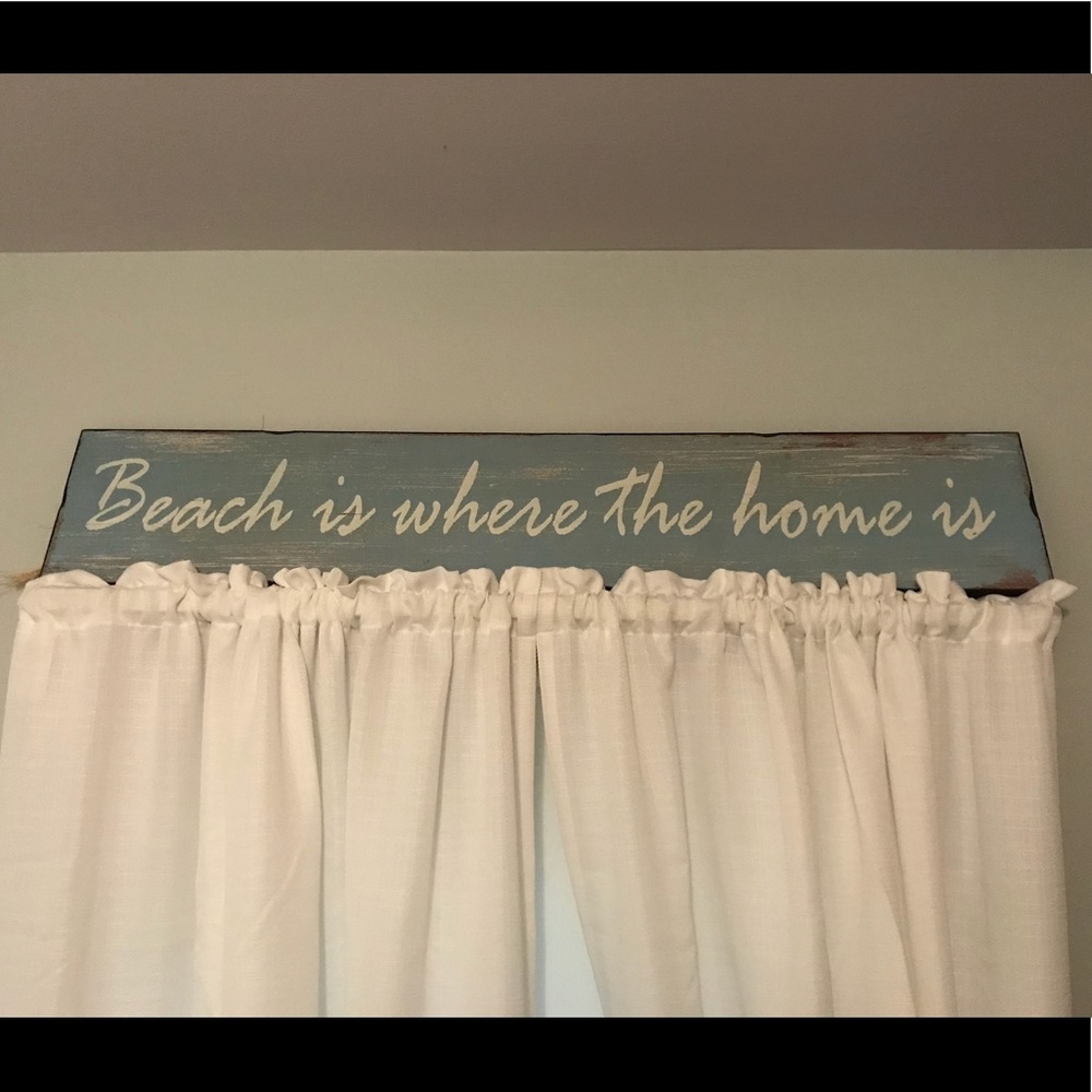 “Beach is where the home is” sign