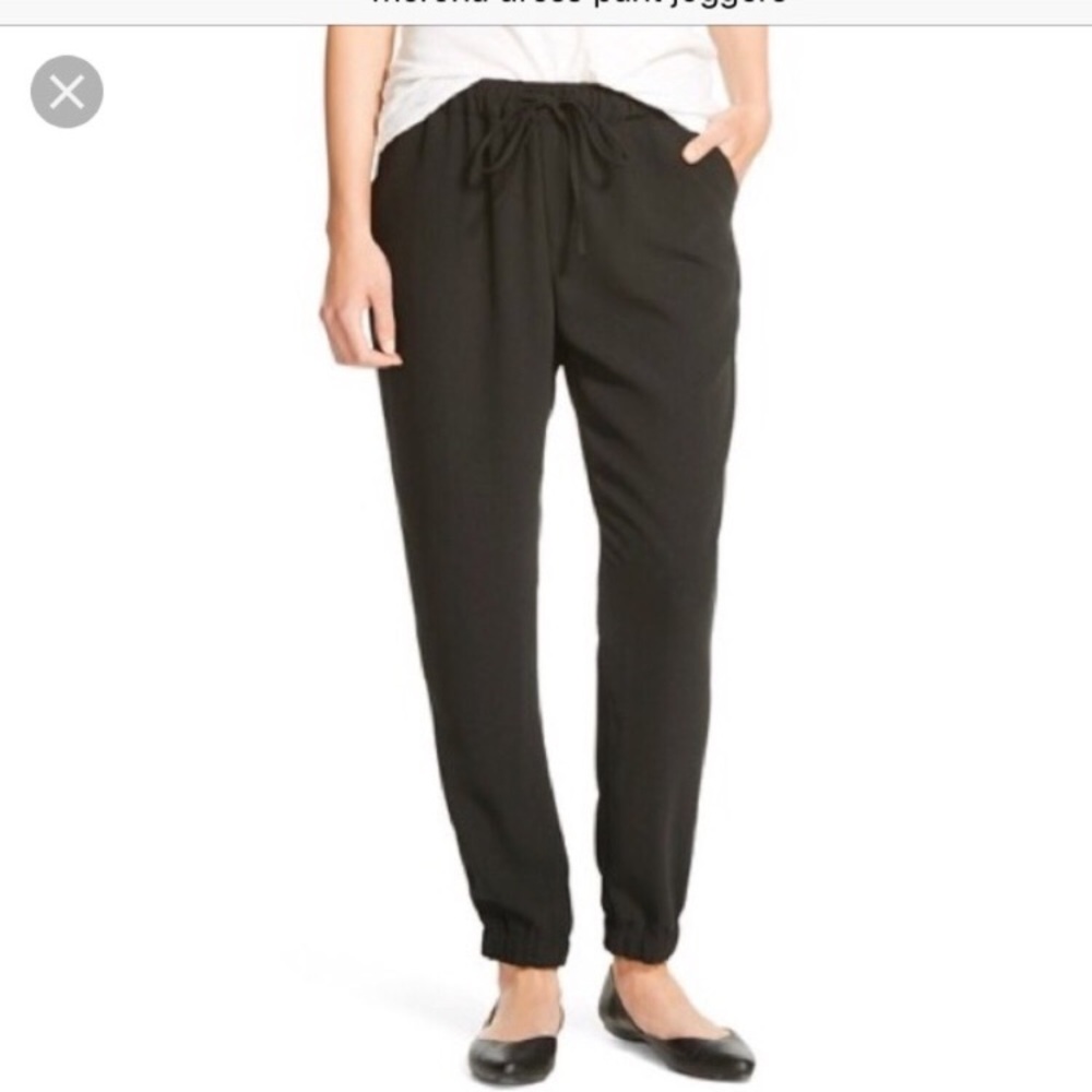 Black dressy jogger pants with drawstring.
