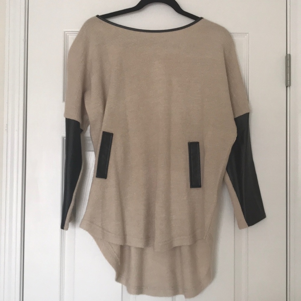Cream sweater with leather looking details