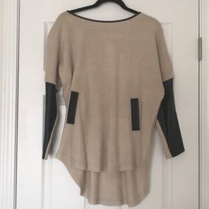 Cream sweater with leather looking details