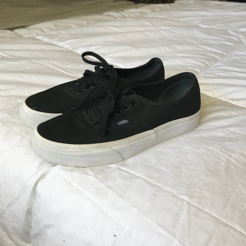 Solid black vans with white soles