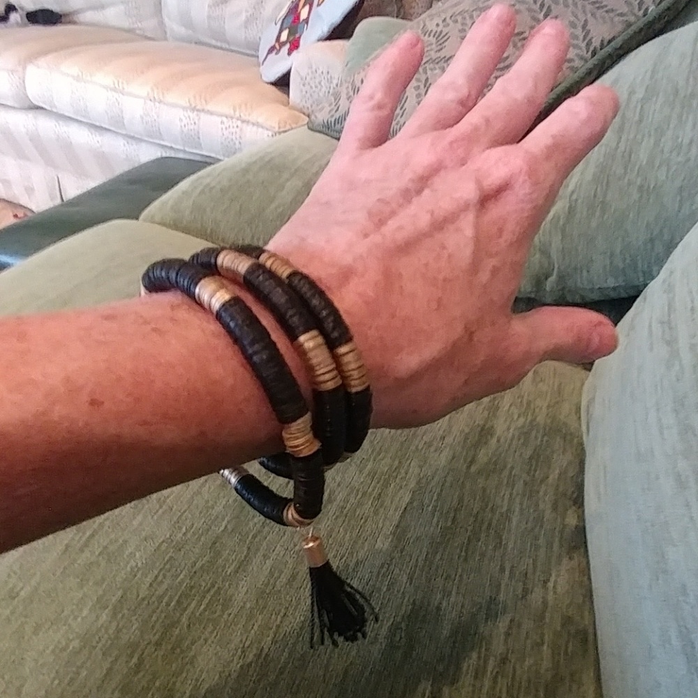 TRIO OF STRETCHY BLACK AND GOLD BRACELETS