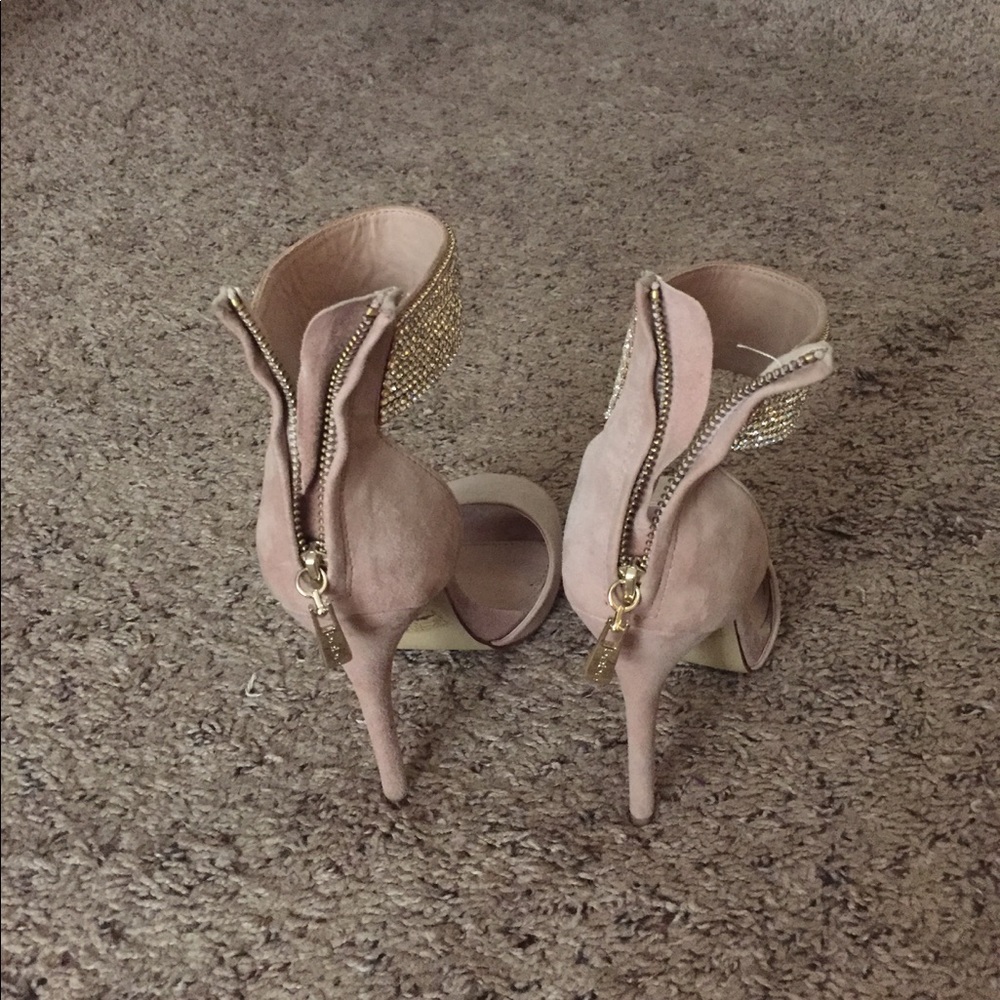 Bebe heels with rhinestone around the ankle.