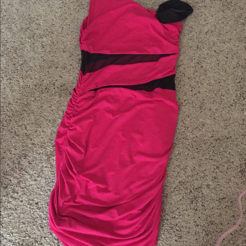 A fuchsia colored dress with mesh inserts