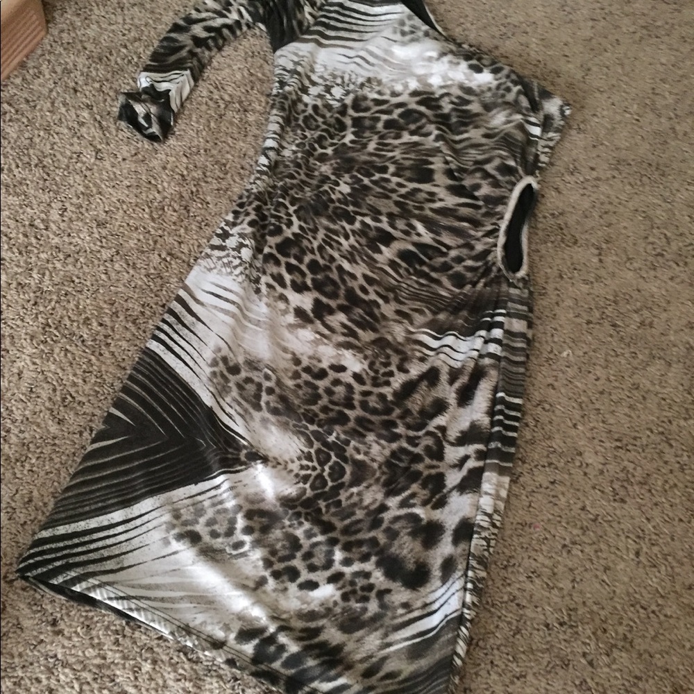 A one sleeve multi print dress with side cut out