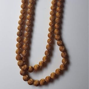 Goldtone carved bead necklace