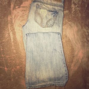 Light wash destroyed flare jeans