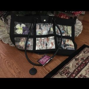 Joann Ann Design 6 pocket black photo bag.