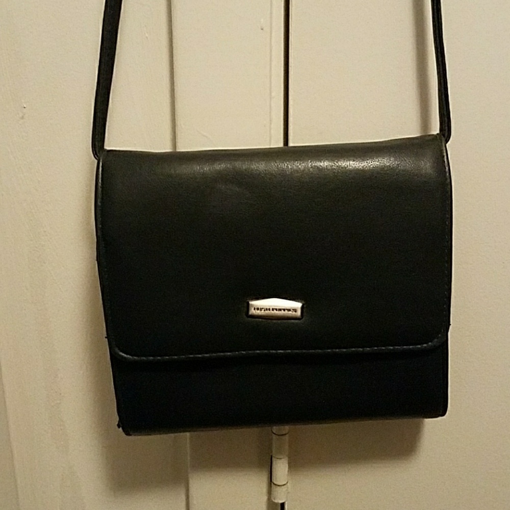 Navy blue shoulder bag..with several compartments.