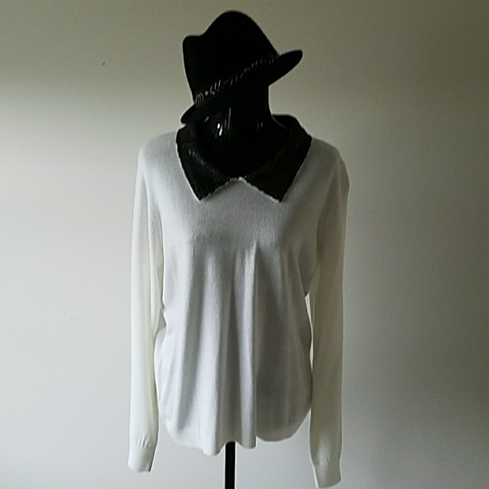 Soft white sweater with black sequin collar