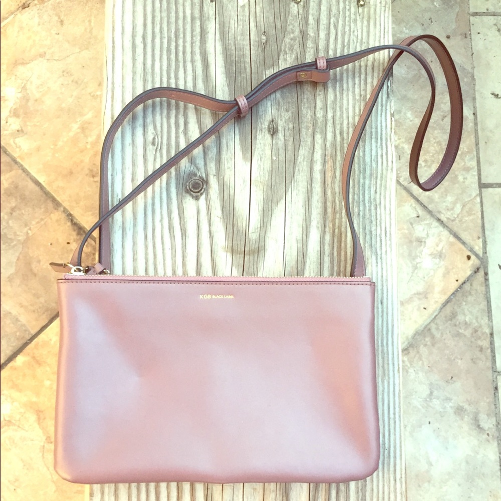 100% leather mauve 3-pocket purse.