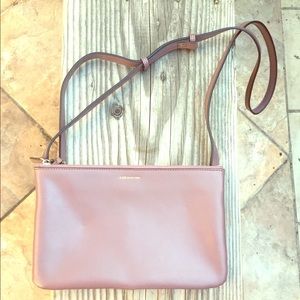 100% leather mauve 3-pocket purse.