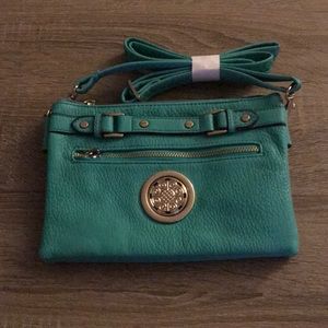 NWOT! Teal cross body with two interior parts
