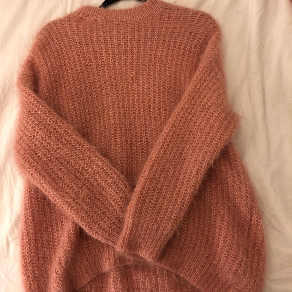 An oversized fluffy sweater