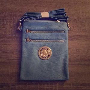 NWOT! BRAND NEW light blue cross body with gold