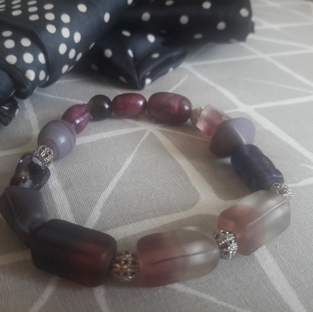 Elegant beaded bracelet with filigree accent.