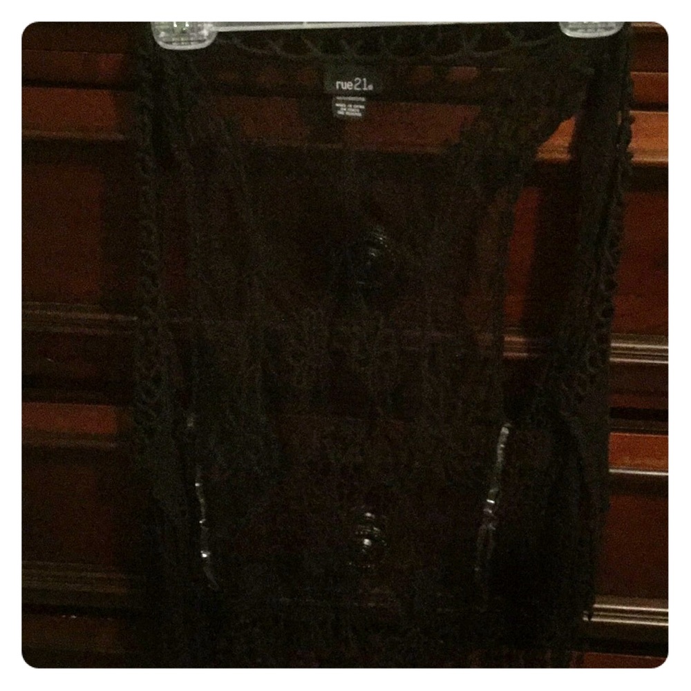 Intricate vest like shawl.