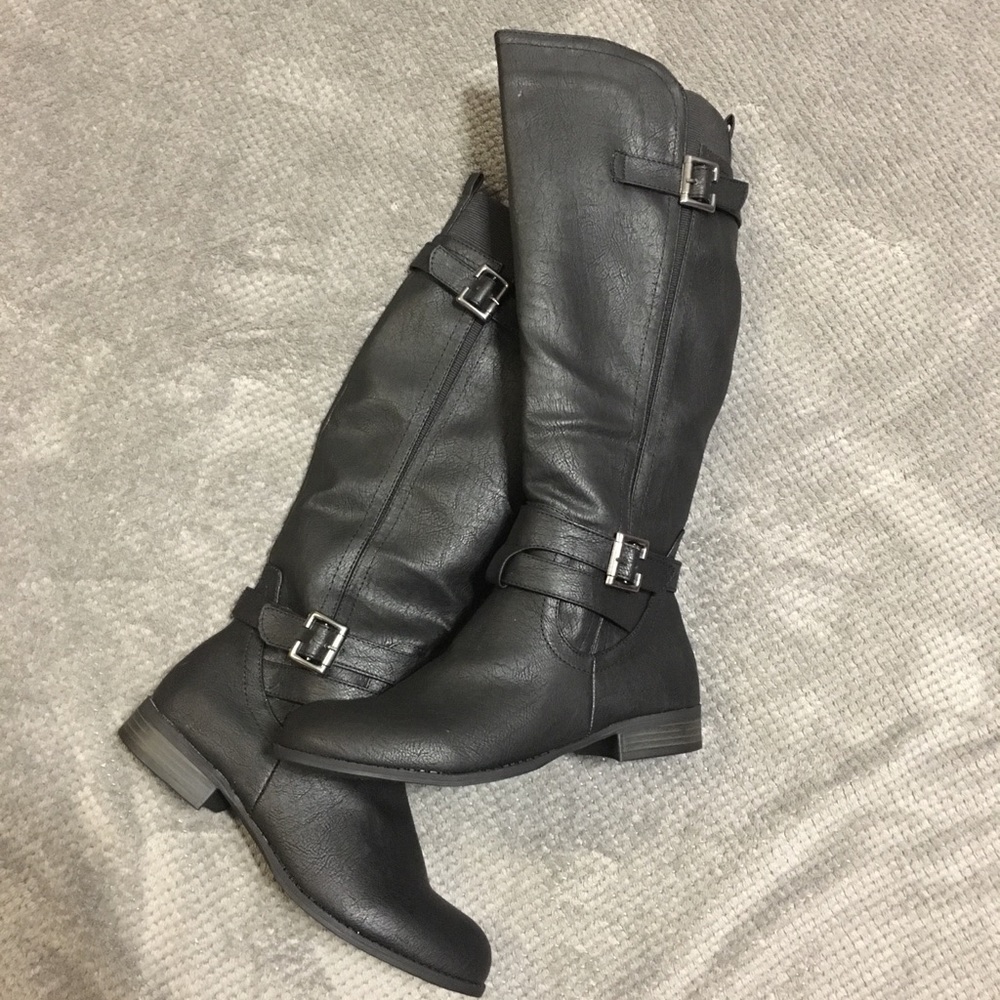 Black knee-high boots with buckles