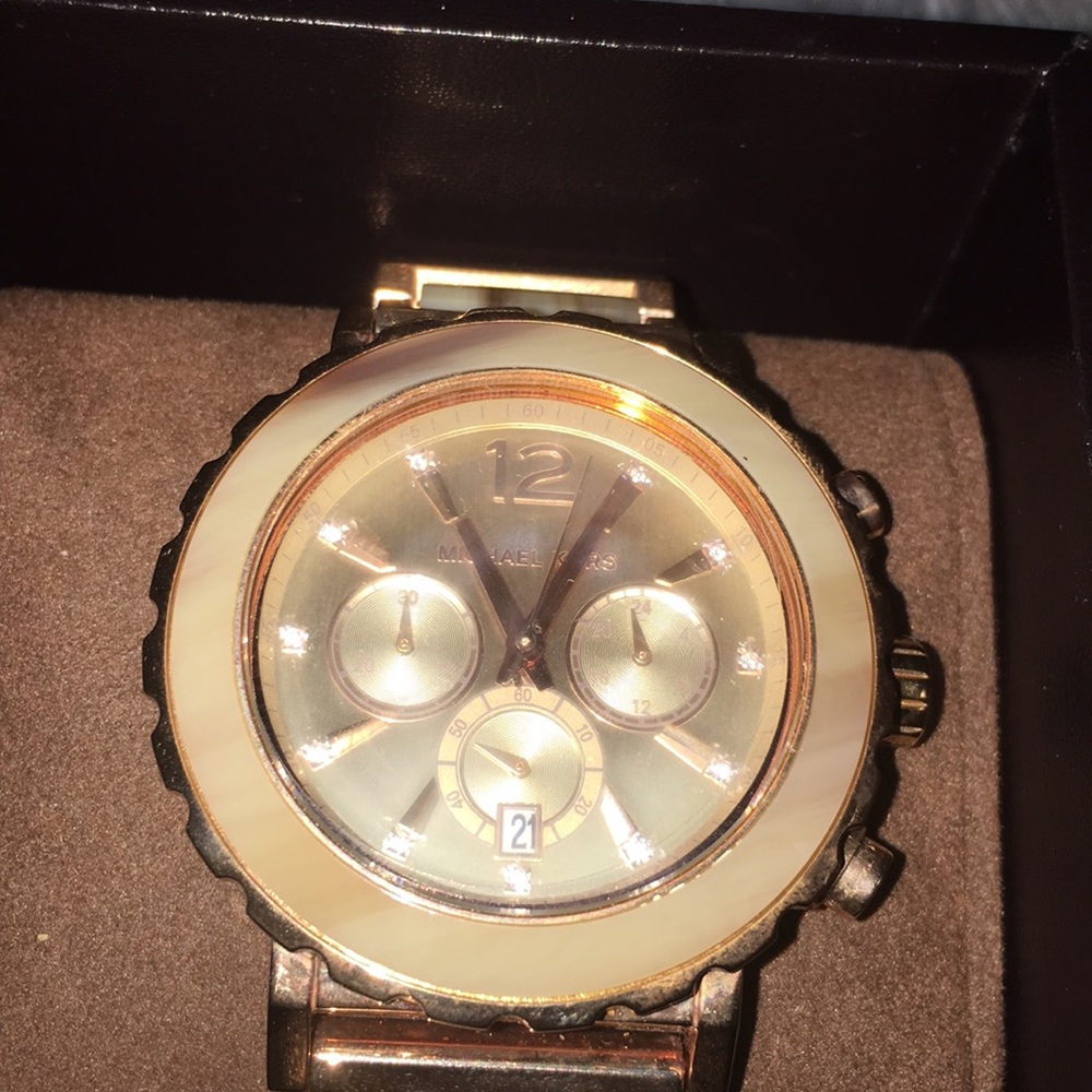 MK rose and Tortoiseshell watch.