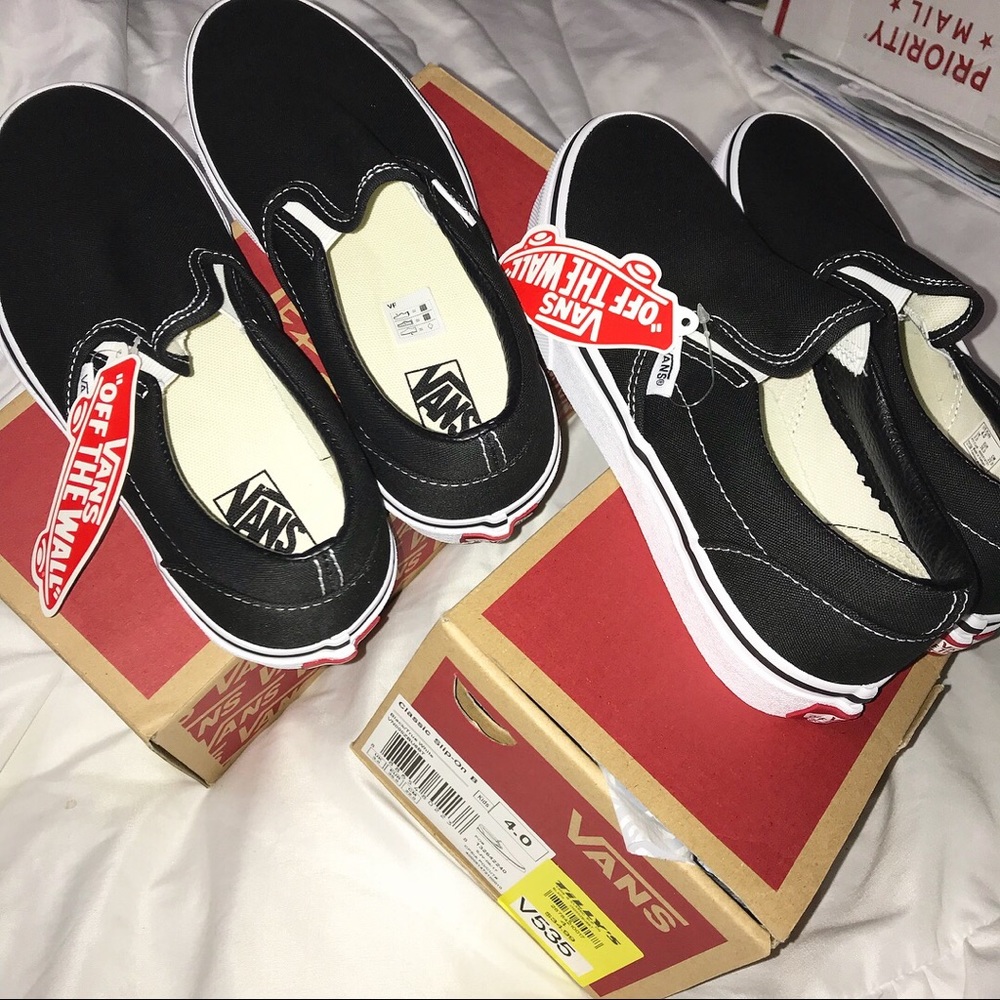Black authentic vans slip ons