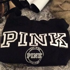 Hooded pink sweatshirt in black.Half zip with hood