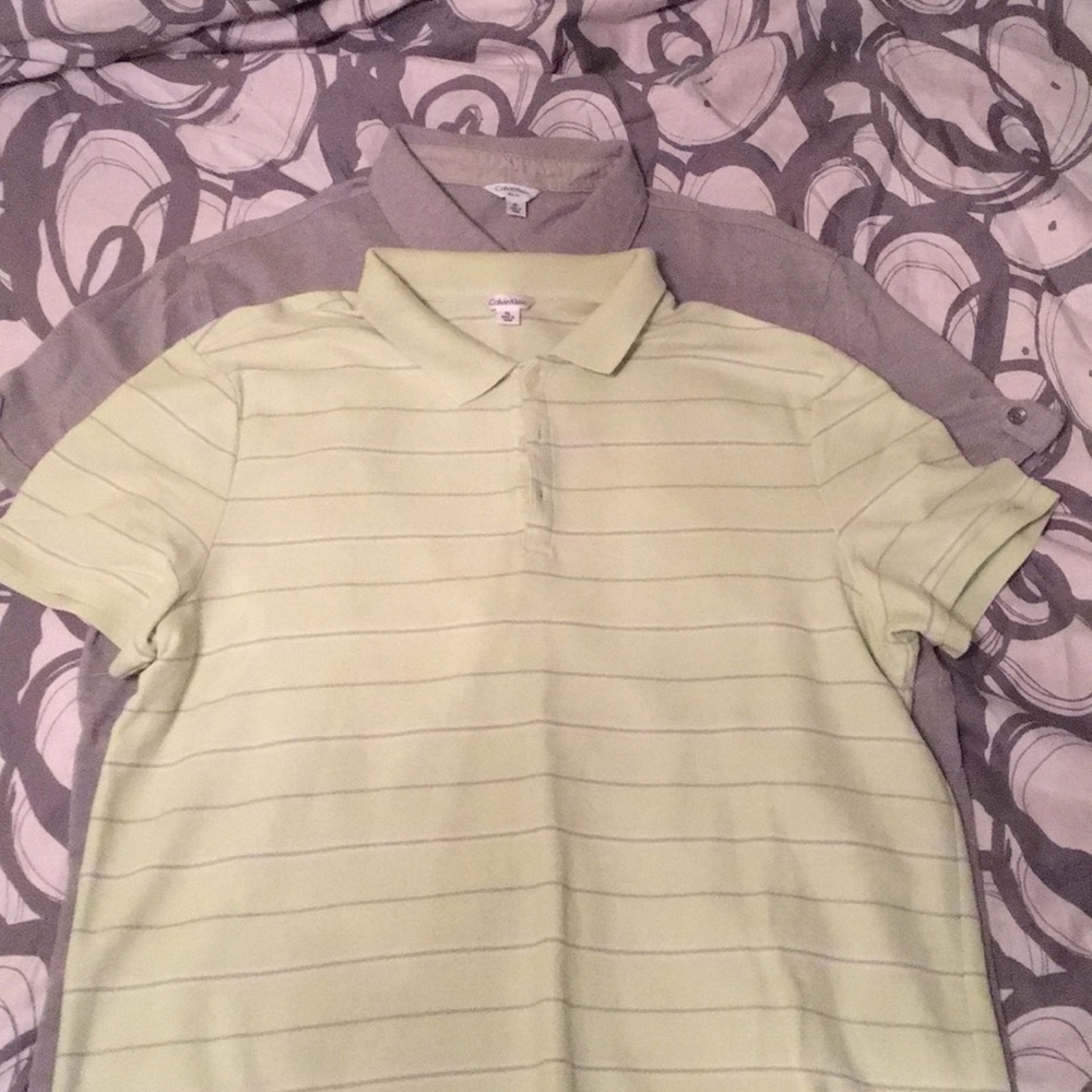 Pair of men’s Calvin Klein polo shirts.