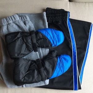 A bundle of boys pants and snow mittens.  Used