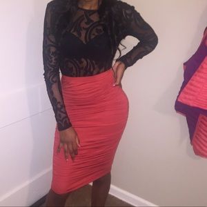 Bodysuit with a burnt orange skirt