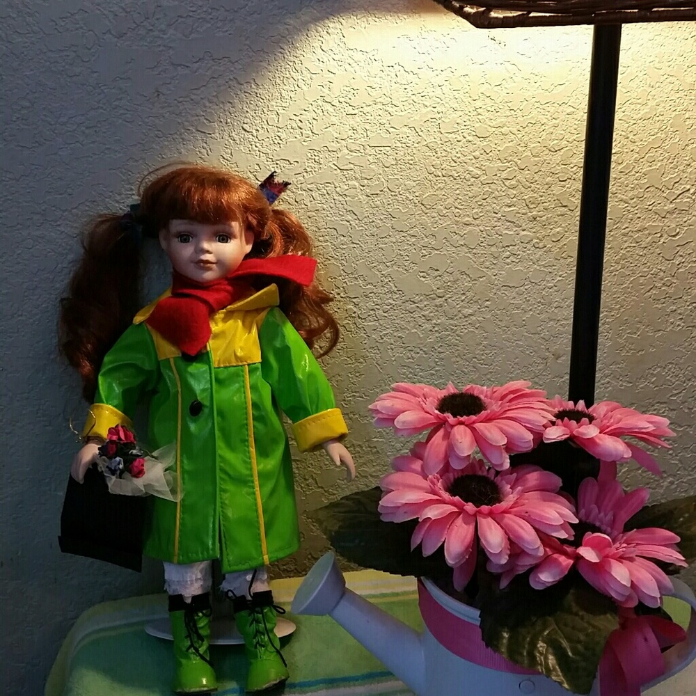 PORCELAIN DOLL WITH RAIN GEAR EGPC