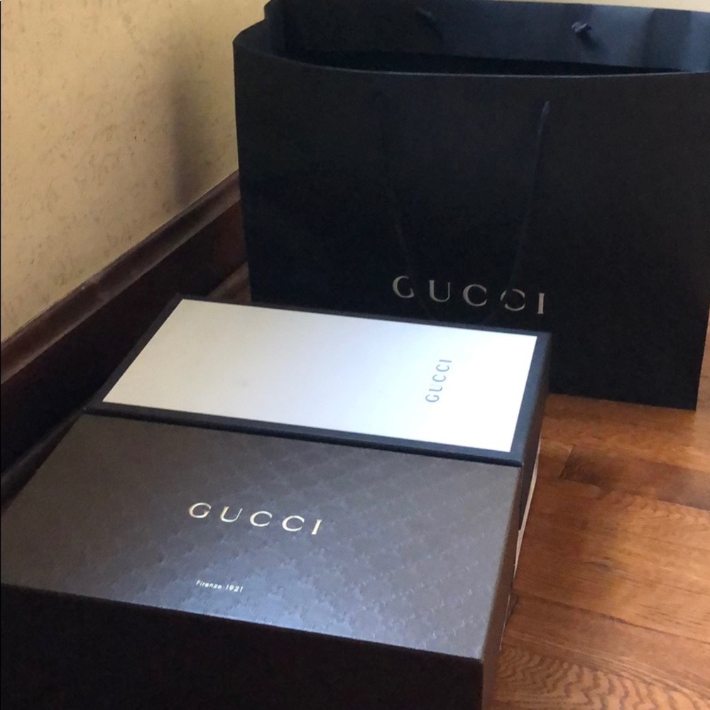 Gucci shoe boxes and shopping bags