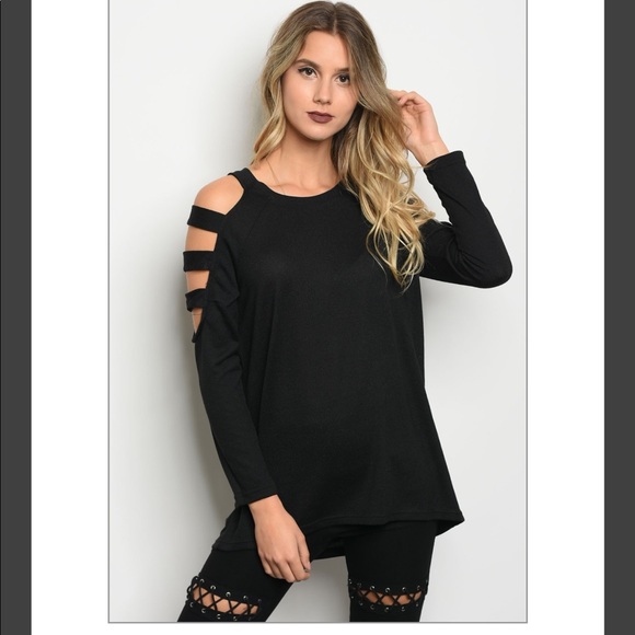 Long sleeve knit top with a sleeve cutouts. - Picture 1 of 2