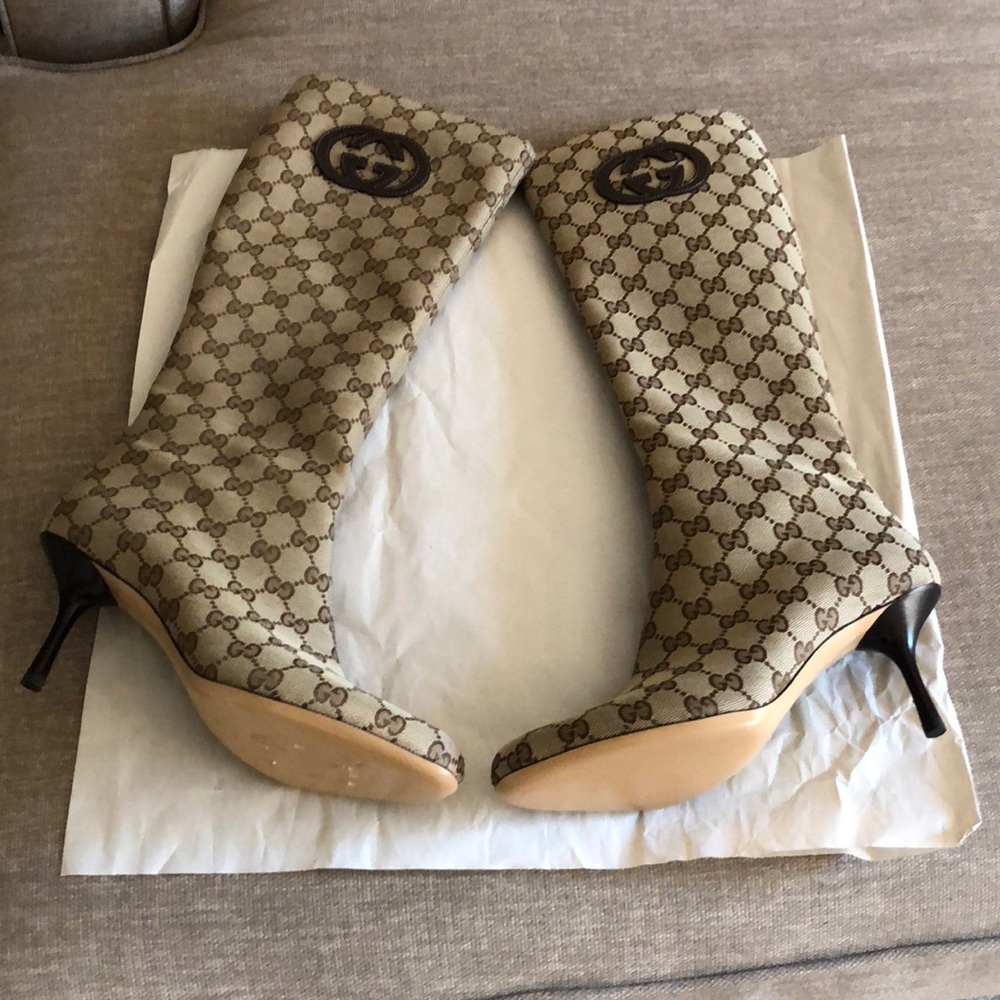 A Pair of Monogram Gucci Boots