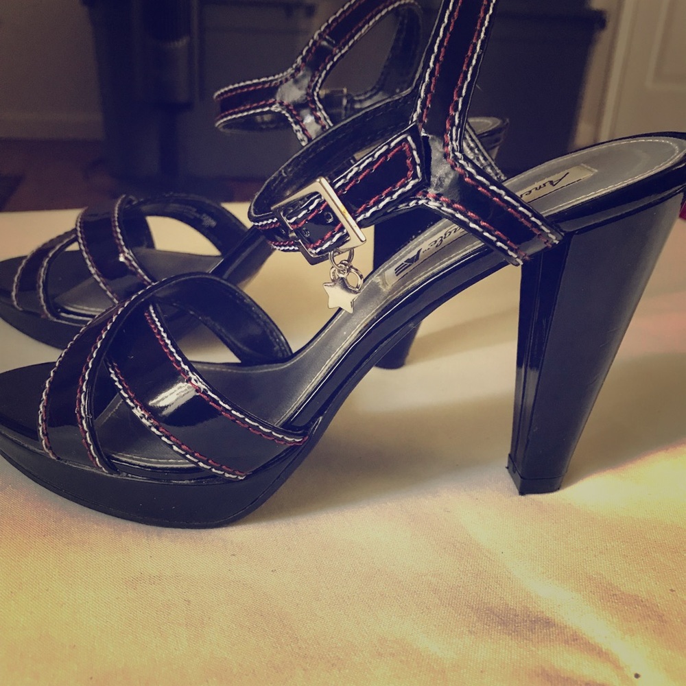 Black heels with red and white stitching details