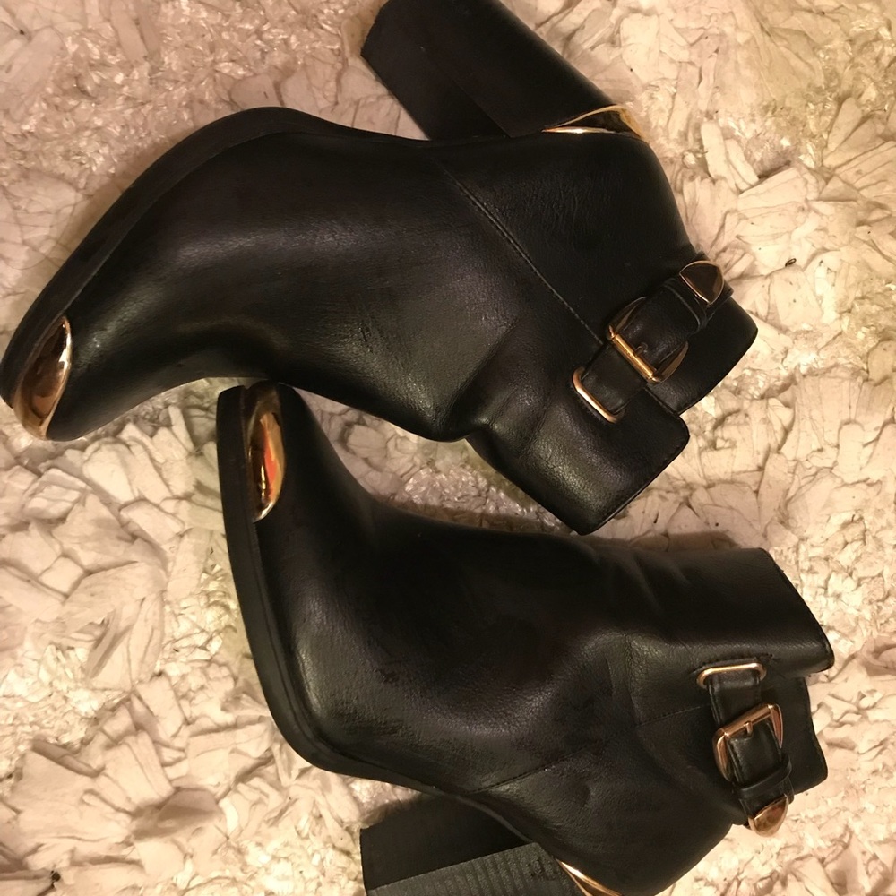 Black boots with gold accents