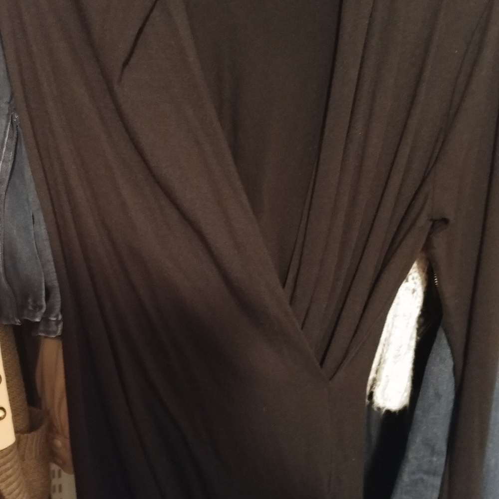 Long sleeve form fitting black sleek shirt