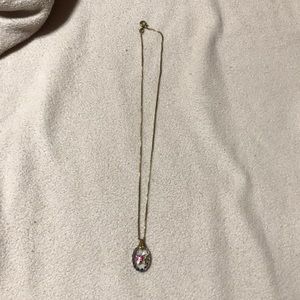 Butterfly pendant necklace with gold chain.