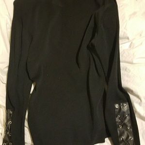 Black shirt with leather crossing cross sleeve