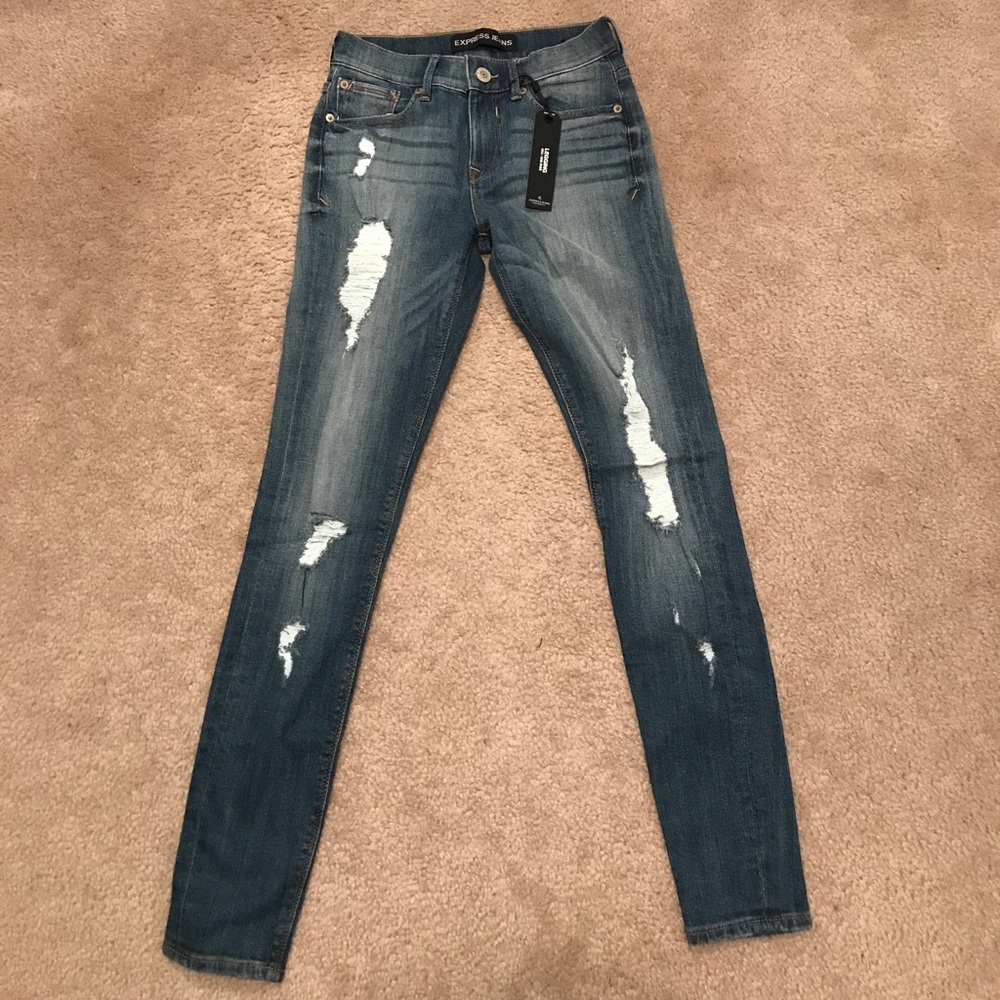 Distressed mid rise jean legging light wash