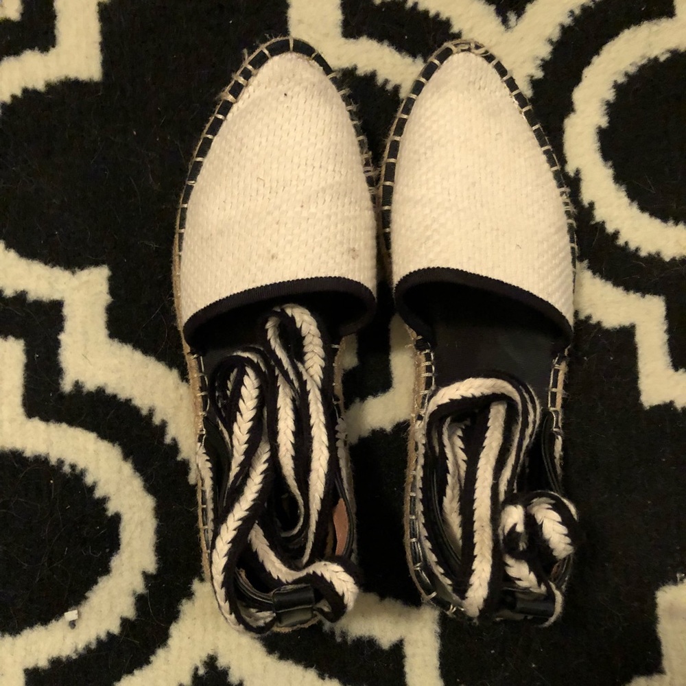 Black and white tie up shoes