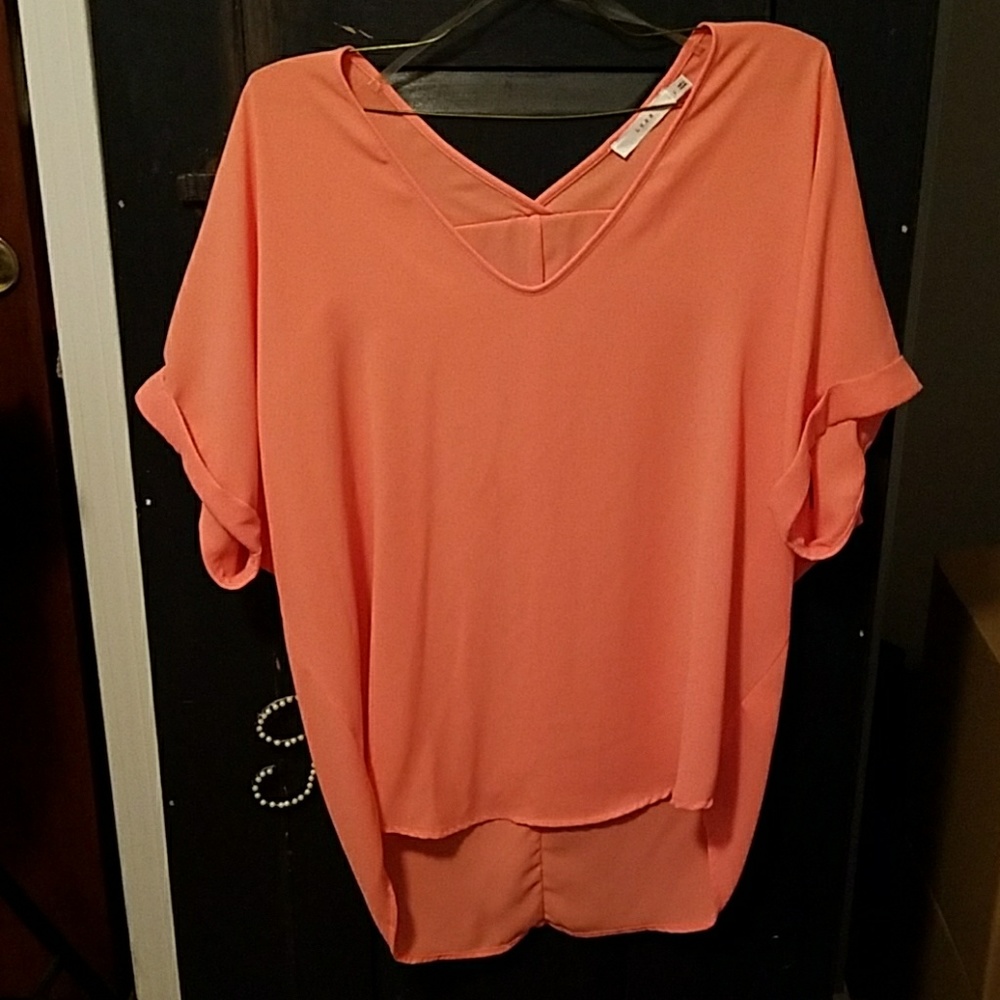 Peach/coral colored blouse