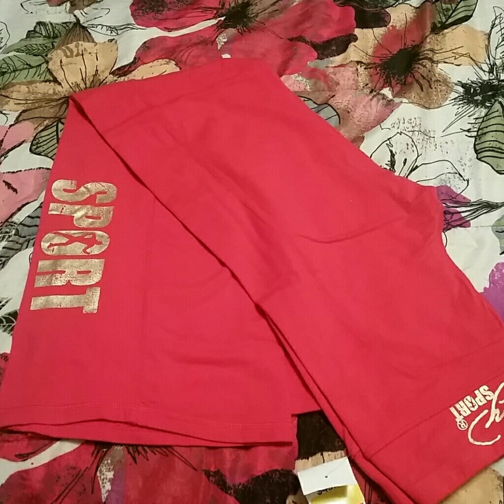 orange flare sweats and black and pink track pants