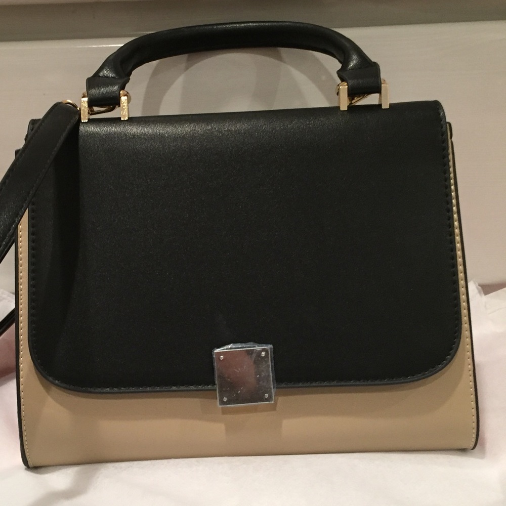 Trapeze-inspired genuine leather handbag. NWT.