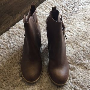Cute, brown boots with four inch heel.
