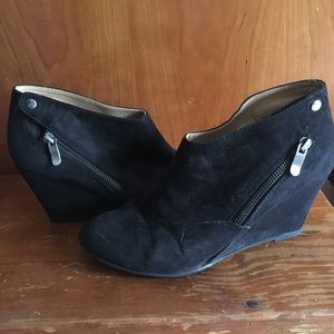 Black wedge heel booties with zipper
