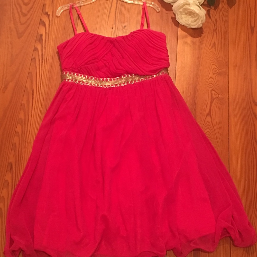 Pink spaghetti strap dress with silver designs.