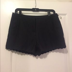 Scalloped black shorts