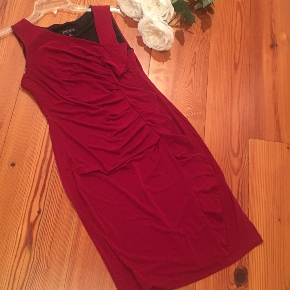 Red dress with ruffles down the middle.