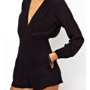 Long sleeved black Bebe romper with sheer sleeves