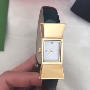 Gold bow watch with black band